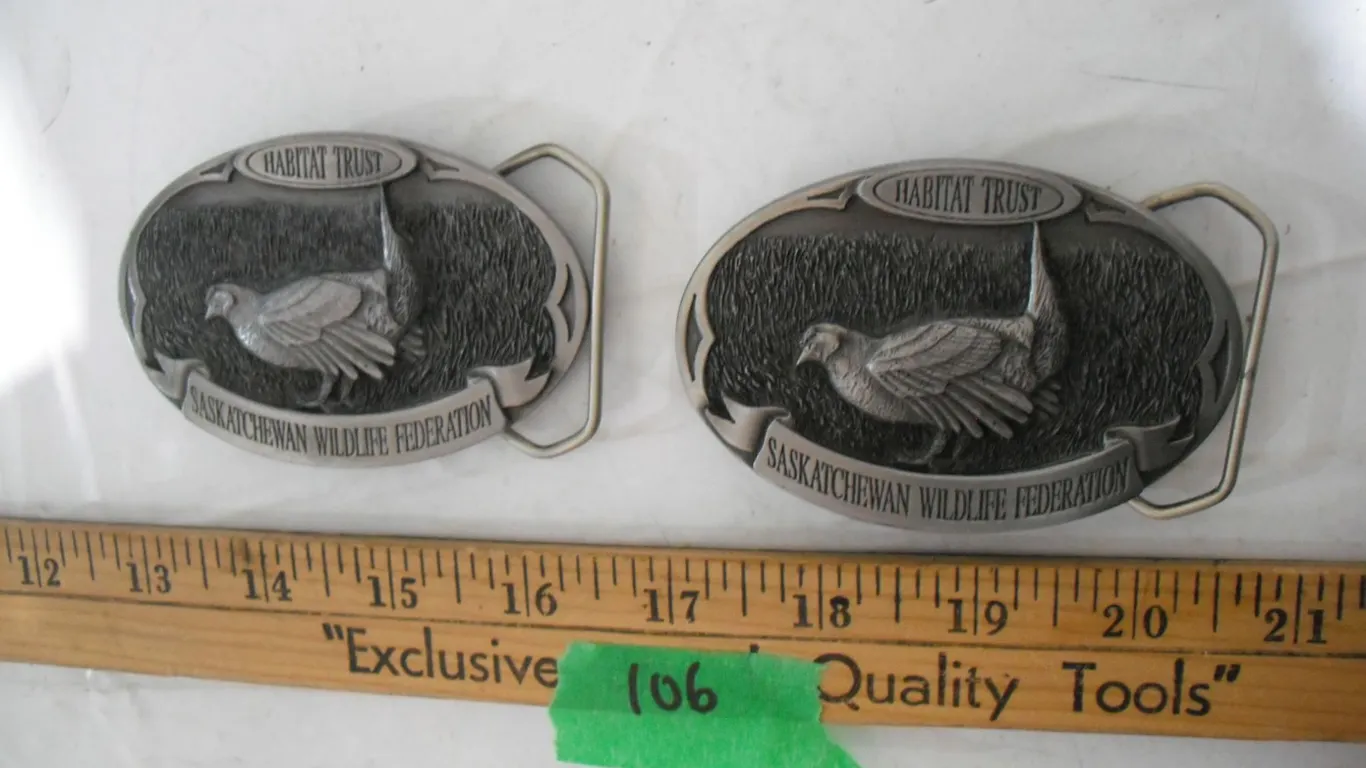 (2) Sask Wildlife Federation Belt Buckles, #’s 674 & 1355/1500