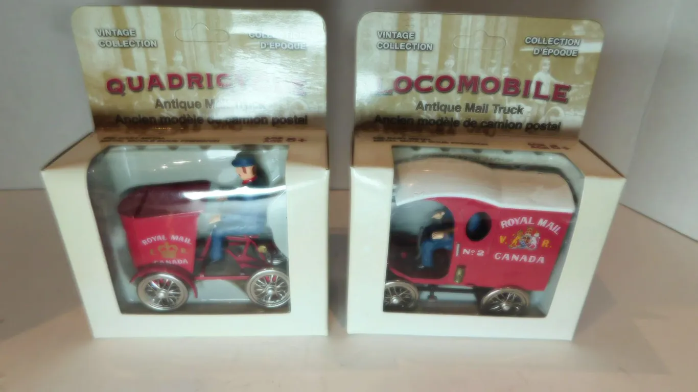 2-POST OFFICE TOY MAIL TRUCKS NIB