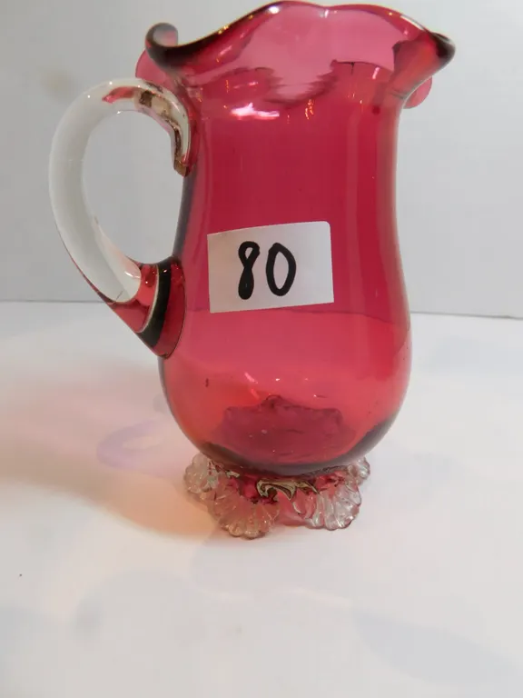 VICTORIAN CRANBERRY RUFFLED GLASS PITCHER 4 ½ “TALL, SMALL CHIP ON ONE FOOT