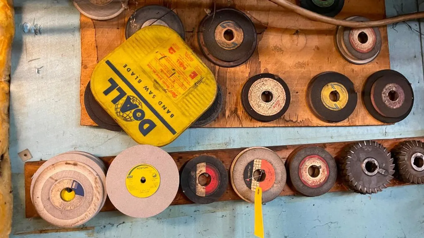 Assortment of Grinding Wheels on Wall