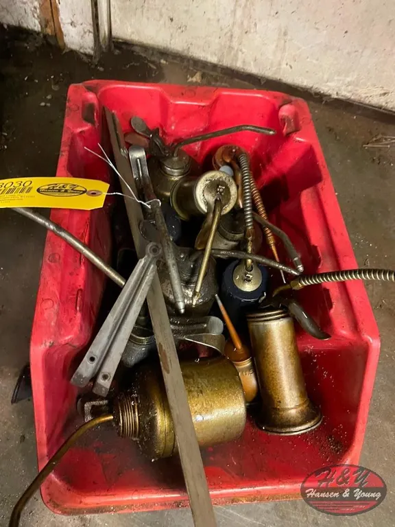 Bin of Oil Cans