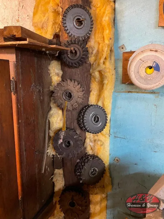 Assortment of Cutters Hanging on Post and Wall