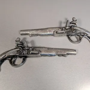 Pair of Decorative Cast Metal Flintlock Pistol Replicas