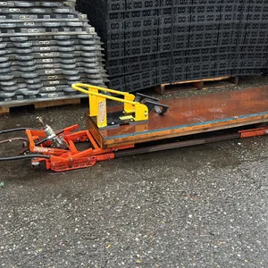 HYDRAULIC 7' FLOOR JACK WITH MAXXHAUL MOTORCYCLE WHEEL CHUCK ATTACHED TO WOOD PLATFORM