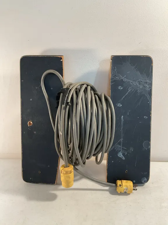 Heavy Duty Extension Cord Wrapped on Wood Storage Reel Panel