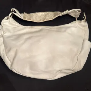 White DXTouch Handbag with Rhinestone Accents and Textured Details
