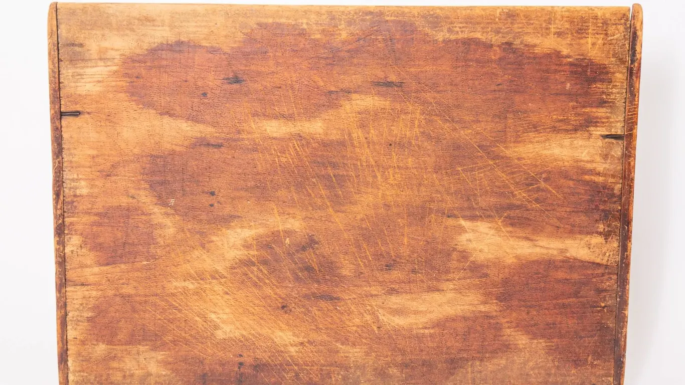 PRIMITIVE WOODEN BOARD WITH A WARM AGED PATINA.