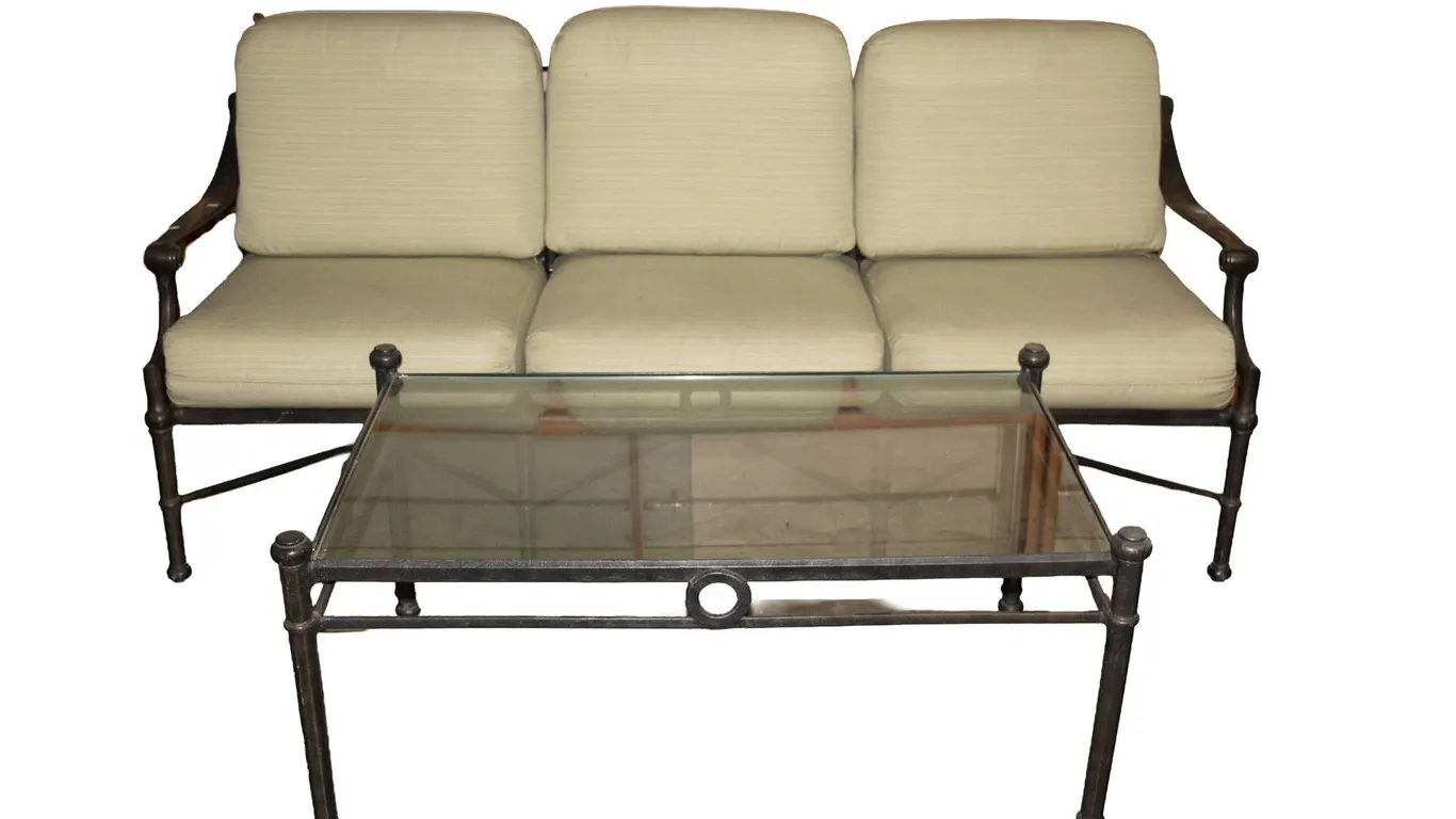 BLACK ALUMINUM THREE CUSHION SOFA AND METAL GLASS TOP COFFEE TABLE.