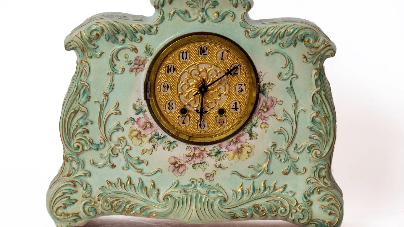CHINA MANTLE CLOCK WITH PENDULUM INCLUDED.
