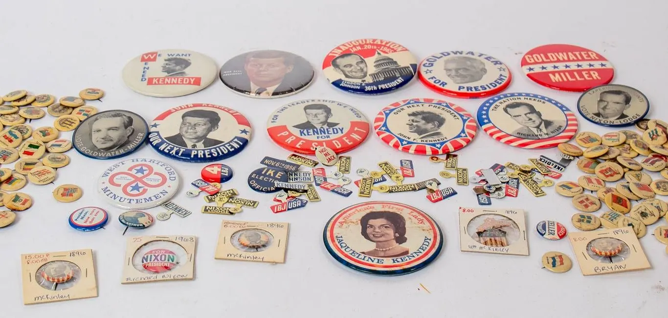 POLITICAL BUTTONS FEATURING GOLDWATER, IKE, AND KENNEDY.