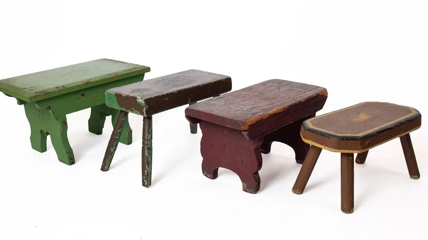 FOUR PRIMITIVE FOOT STOOLS 9" H., 16" W., 8.5" L.