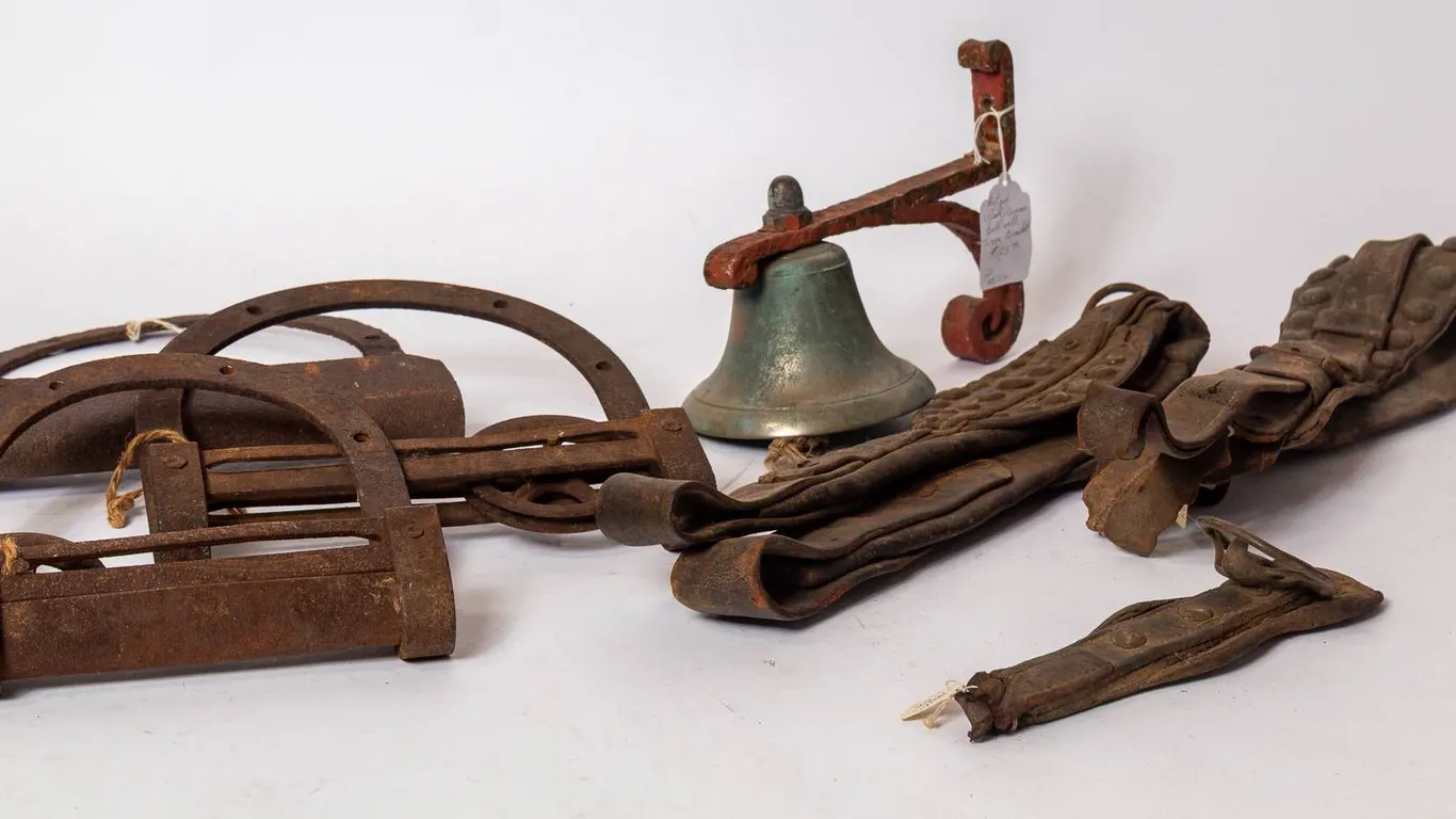 CAST IRON BARN DOOR ROLLERS AND HANGERS, BRONZE BELL, LEATHER HARNESS PARTS.