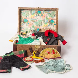 DOLL TRUNK WITH DOLL TOYS AND CLOTHES, 6" H., 13" W., 9" L.