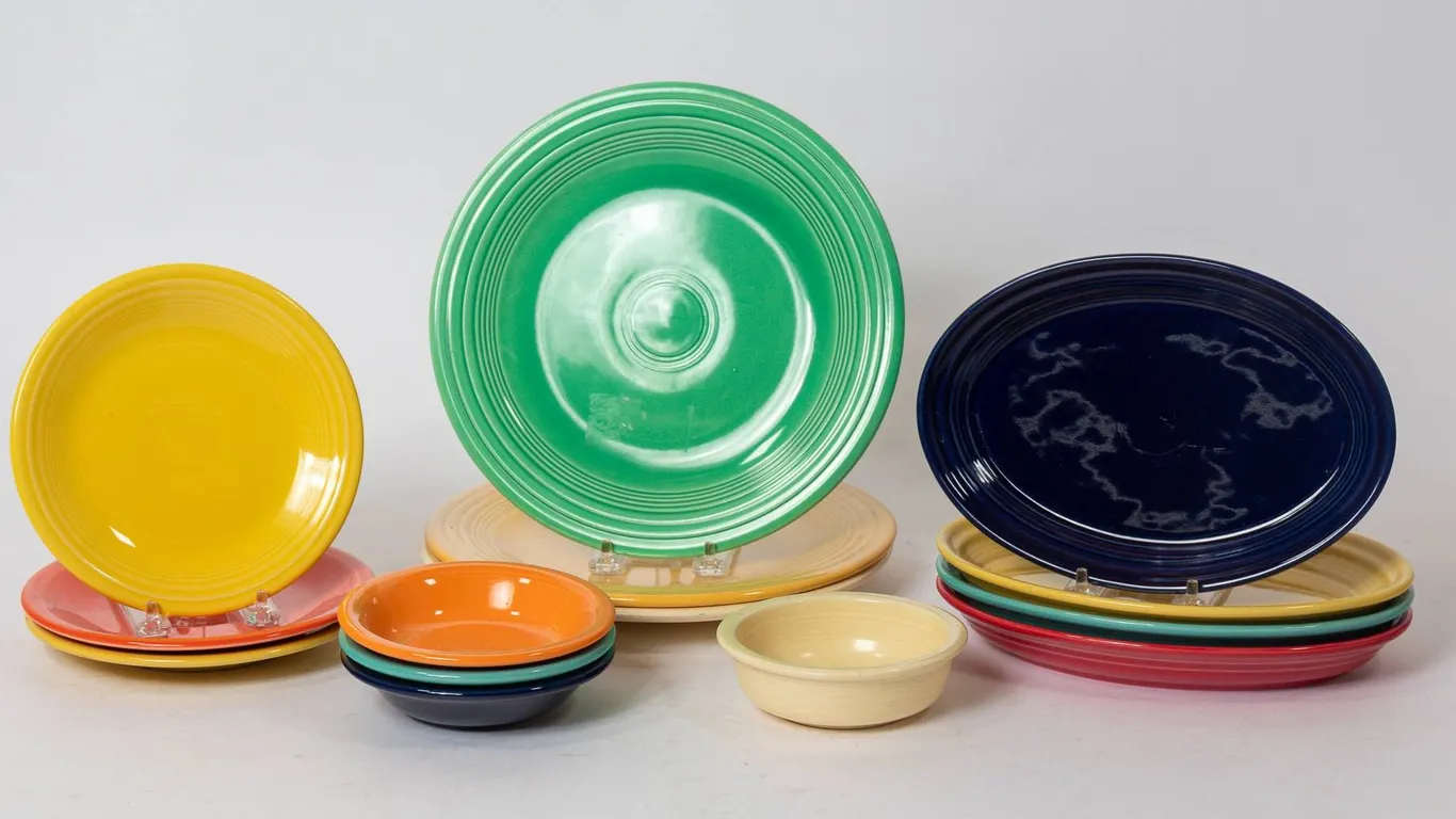 FIESTA WARE PLATES, BOWLS, AND PLATTERS.