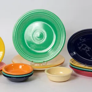 FIESTA WARE PLATES, BOWLS, AND PLATTERS.