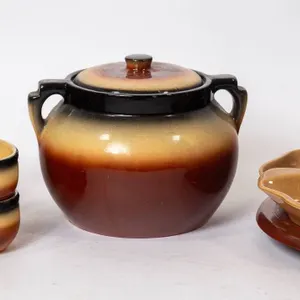 MCCOY POTTERY LAZY SUSAN SET AND EDMOND POTTERY BEAN POT WITH BOWLS.