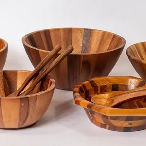 WOODEN KITCHEN ITEMS INCLUDING BOWLS AND SALAD UTENSILS.