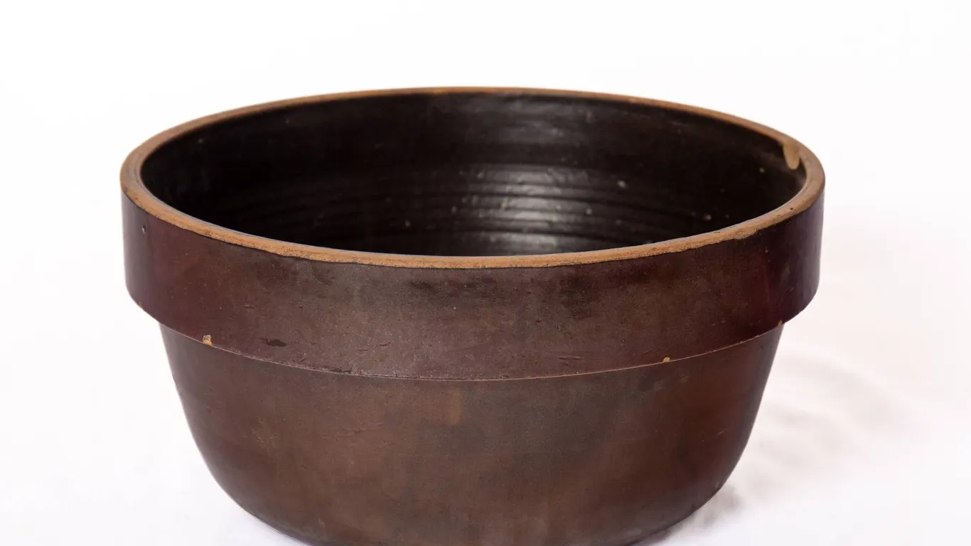ANTIQUE BROWN GLAZED STONEWARE BOWL 7" H., 13" W.