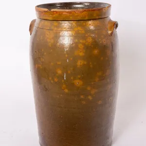 ANTIQUE BROWN GLAZED OVOID JAR WITH HANDLES.