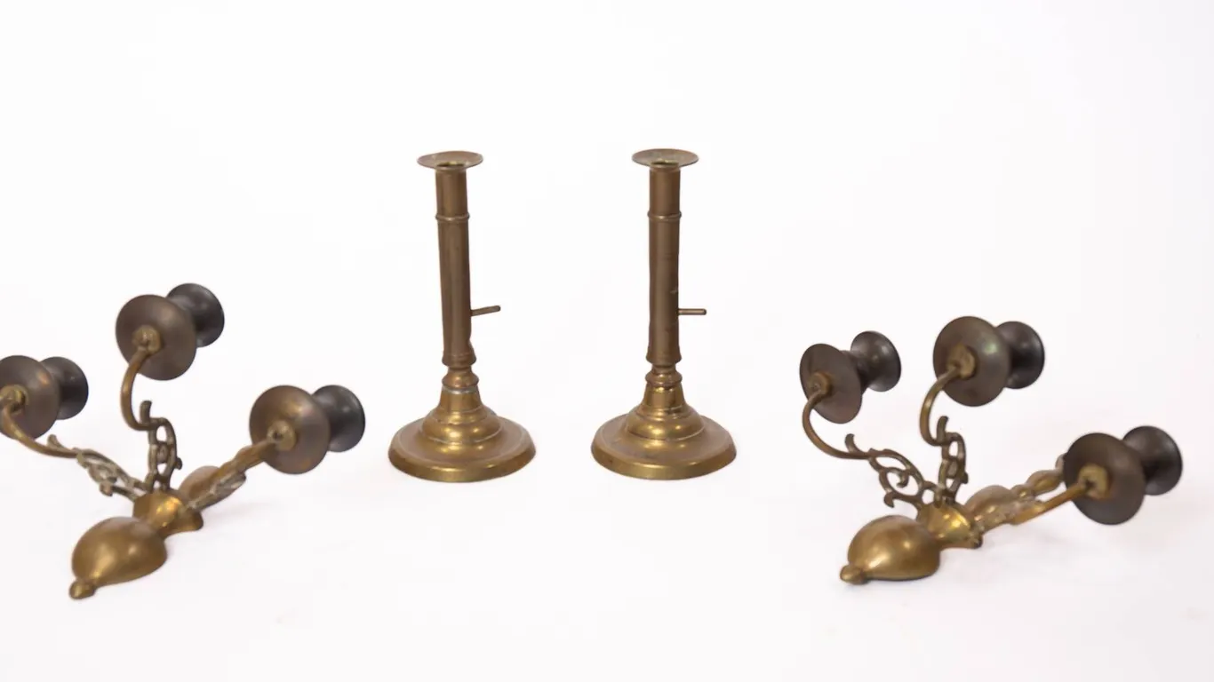 BRASS PUSHUP CANDLESTICKS AND CANDLE SCONCES.