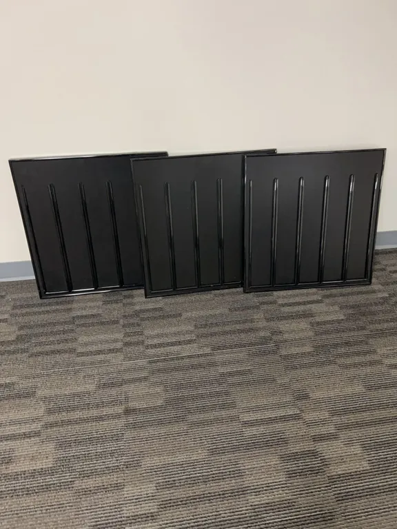Three Black Metal Wall Panels with Vertical Grooves