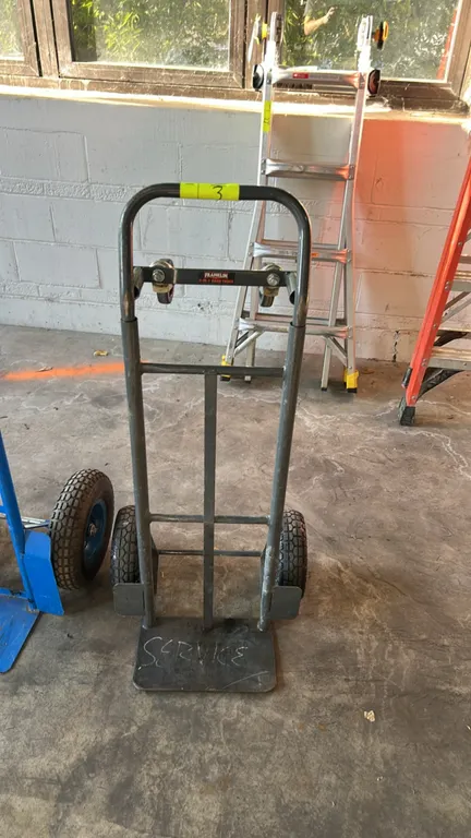 Franklin 2-in-1 convertible hand truck. Features steel tubular frame convertible between 2-wheel upright and 4-wheel platform configurations, two pneu