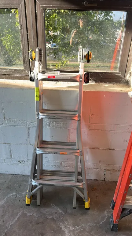 Gorilla Ladders MPXA aluminum multi-position ladder. Features adjustable position hinges and Type IA 300 lb. load capacity. 18' reach. Orange ladder i