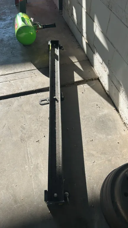 OTC 414-016/1 spreader lifting beam. Features steel channel construction, 3,000 lb working load limit (WLL), center lifting eye, and multiple adjustme
