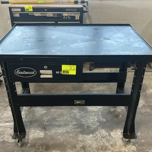 Eastwood portable teardown workbench table. Features steel top with raised perimeter lip and integrated fluid drain grate, single lockable storage dra