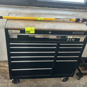 Waterloo Traxx Series multi-drawer rolling tool chest. Features black steel construction, wood work surface top, side push handle, and multi-drawer st