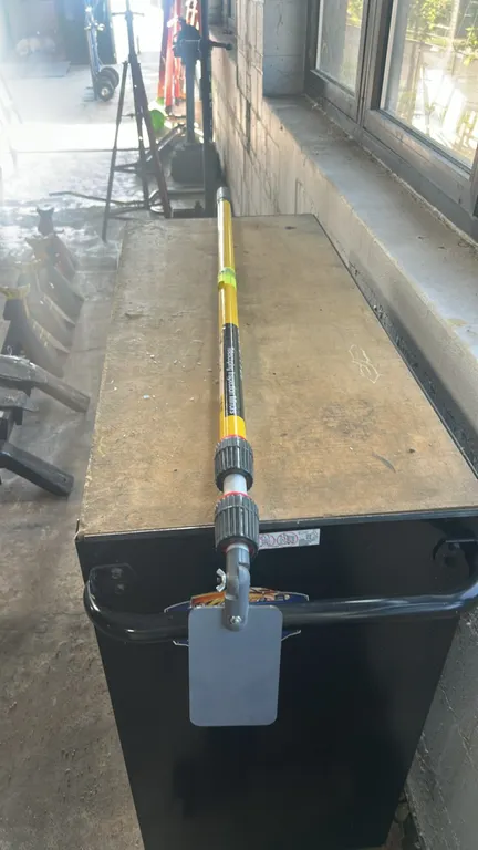 Extend-A-Vue telescoping inspection mirror. Features an adjustable rectangular mirror on a swivel mount with wing-nut tensioner, multi-section telesco