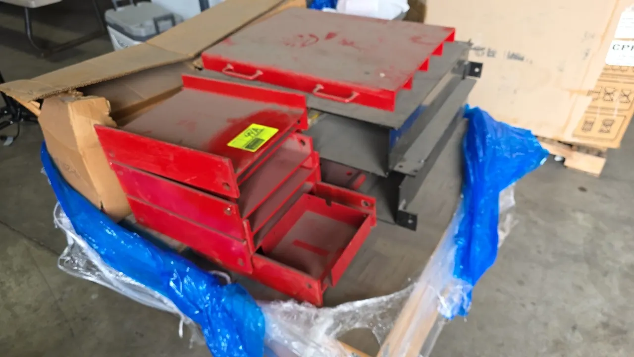 Rotary RJ7000Y rolling jack. Includes assorted mounting brackets, adapters, and accessories packaged in two boxes. Steel construction with red and bla