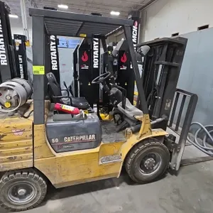 Caterpillar GP25 LP-gas forklift. Features a 172" maximum lift height mast, Cascade side-shift carriage, forks, overhead guard, and solid pneumatic ti