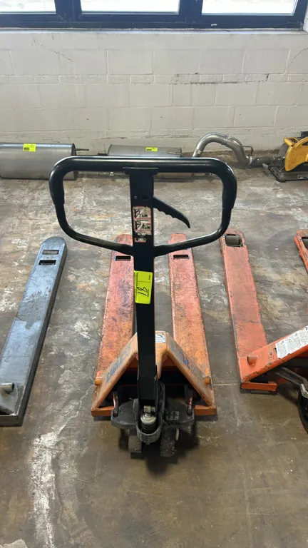 Eagle 55 manual pallet jack. Features narrow fork configuration, manual hydraulic lift, loop handle with 3-position hand control, and tandem load roll