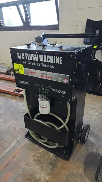 AirSept Ford Rotunda A/C flush machine with Soundsilence Technology. Features pneumatic operation with air regulator, spin-on filter assembly, supply