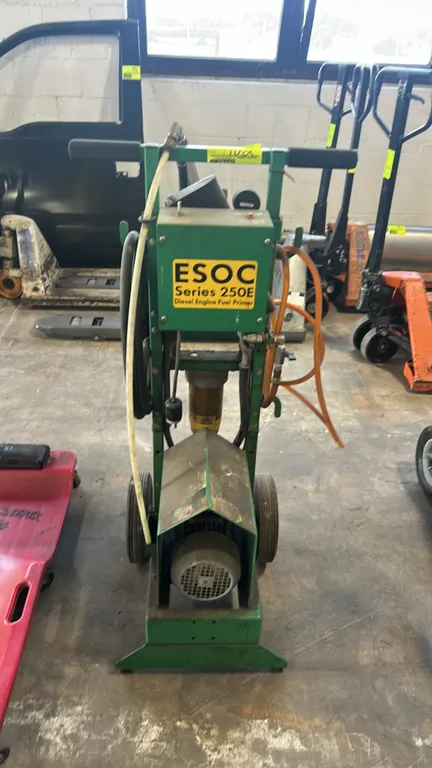 ESOC Series 250E diesel engine fuel primer. Features electric motor pump, integrated fuel filter assembly, pressure gauge, regulator valve, tool tray,