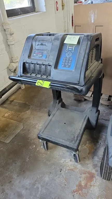 Rotunda GRX-3590 battery diagnostic station. Manufactured by Midtronics for Ford and Lincoln. Features digital display with keypad, integrated printer