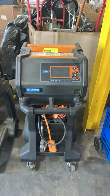 Midtronics xRC-3363 Ford hybrid rescue charger. Features digital display, directional keypad controls, and high-voltage charging cables with connector