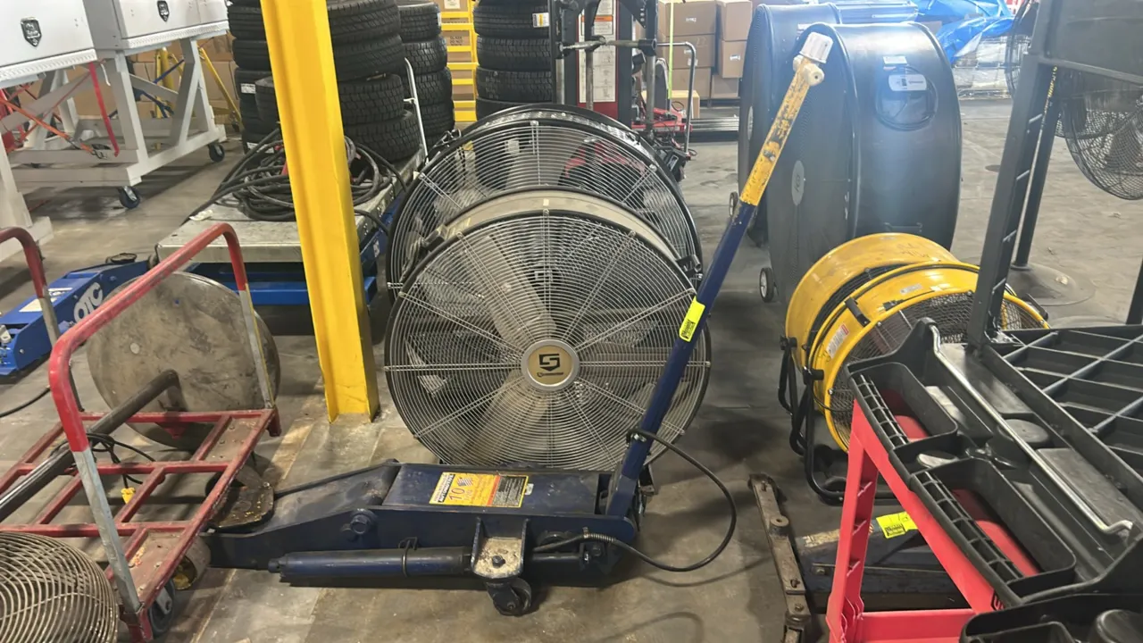 Hein-Werner HW93662 10-ton air/manual hydraulic service jack. Features steel long-chassis construction, large lifting saddle, rear swivel casters, fro