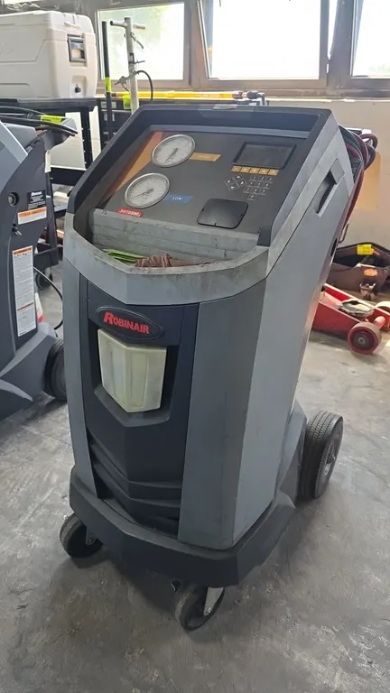 Robinair 34788NI refrigerant recovery, recycling, and recharging station. Features R-134a refrigerant operation, dual analog gauges, digital display w