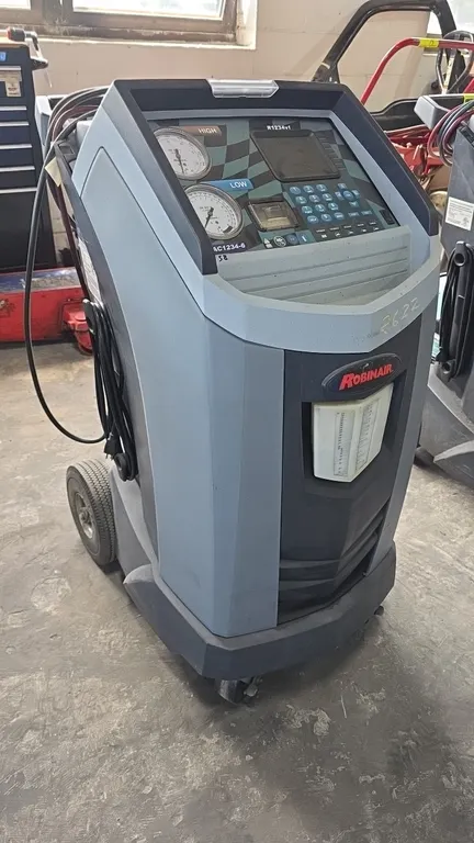 Robinair AC1234-6 refrigerant recovery, recycling, and recharging station. Designed for R-1234yf refrigerant only. Features digital display with keypa