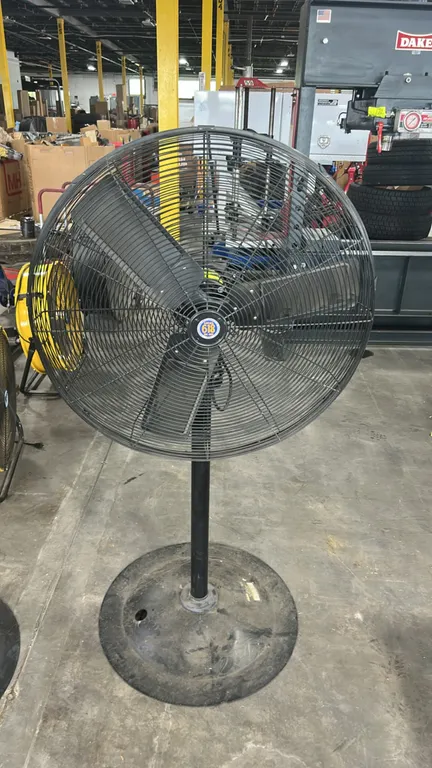 3' industrial oscillating pedestal shop fan. Features a 3-blade metal propeller, front and rear wire safety guard, and an International Brotherhood of