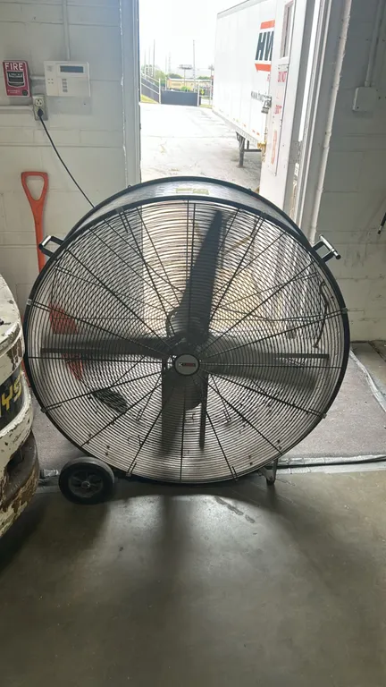 K Tool International KTI-77742 portable industrial shop fan. Features diamond plate drum, wire safety guards, variable speed regulator switch, and dua