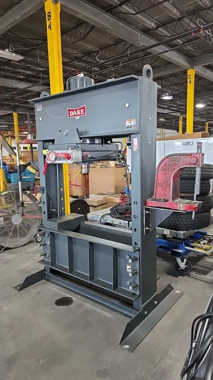 Dake 906850 150-ton air-hydraulic H-frame shop press. Features side-mounted Dake Model 1 arbor press, side-mounted Branick 7400 strut spring compresso