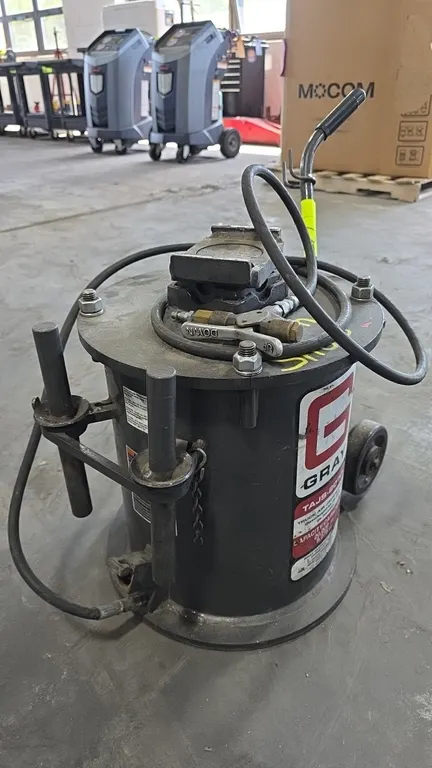 Gray TAJS-2000 truck air jack/stand. 20,000 lb capacity. Features pneumatic operation with lever control valve, lifting saddle, (2) extension adapter