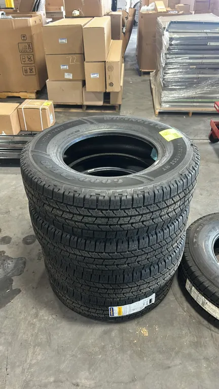 Goodyear Wrangler Workhorse HT light truck tires. Features highway all-season tread design. Size: LT245/75R17. Load range: E. Load index and speed rat