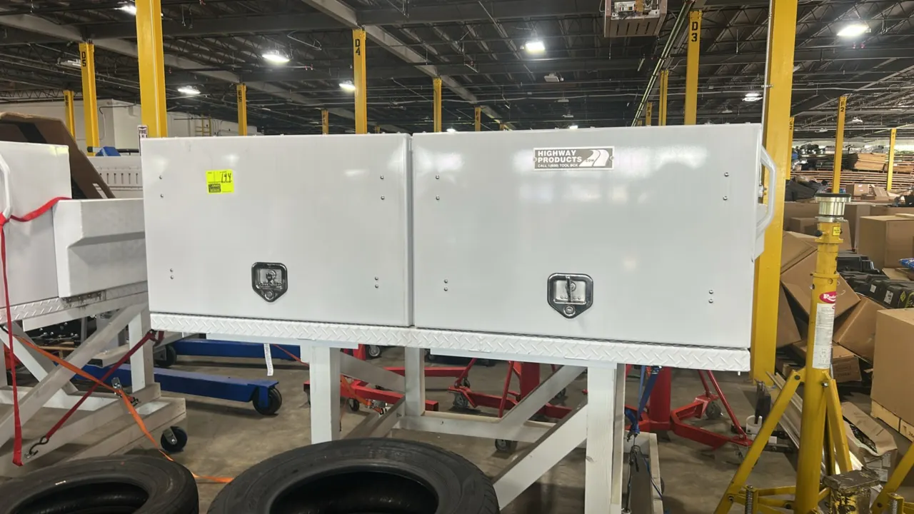 Highway Products topsider truck tool box. Features dual side compartments with drop-down doors, locking T-handle latches, diamond plate deck floor, me