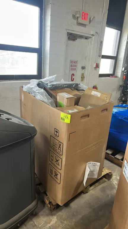 Assorted automotive parts lot. Includes Ford OEM engine wiring harness (P/N CU5Z-12A581-K), front exhaust muffler (P/N 4C4Z-5230-AA), GM molded splash