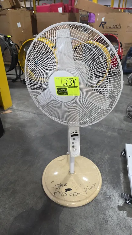 Oscillating pedestal floor fan. Features adjustable height, 3-blade assembly with wire safety cage, and electronic push-button controls with timer. Mo