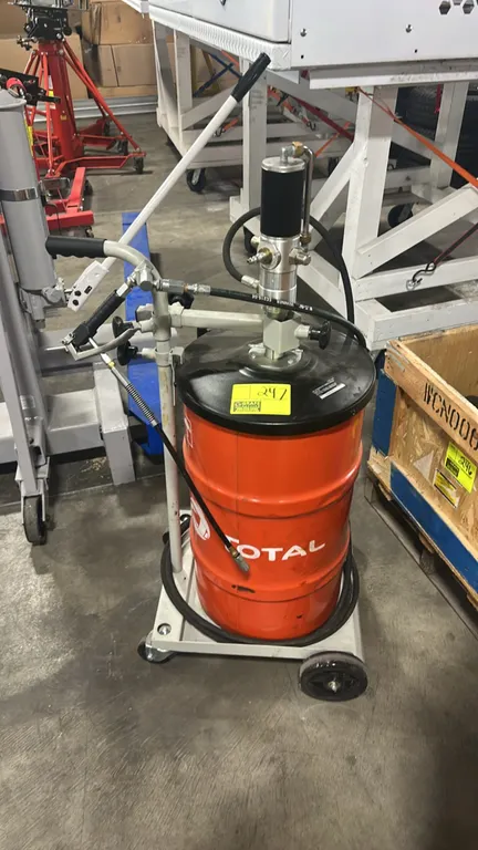Pneumatic mobile grease pump system. Features pneumatic pump assembly mounted to a drum cover, grease dispensing handle with flexible nozzle extension